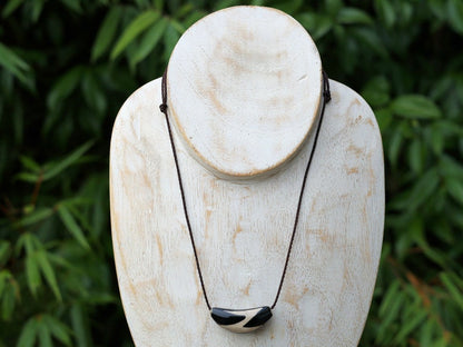 Unique shape DZI. The "Lightning" pattern in relation to Dzi beads refers to a specific type of Dzi bead that has a unique appearance resembling a lightning bolt or zigzag pattern.