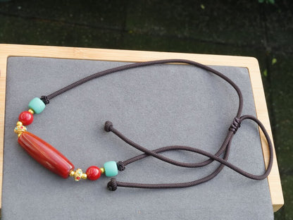 Carnelian Onyx DZI bead Agate Stone Choker, with an adjustable necklace with a slide knot.  Features red and  turquoise spacer beads.