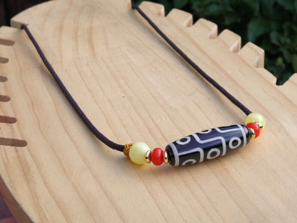 Black white Carnelian Onyx DZI nine bead Agate Stone Choker, with an adjustable necklace with a slide knot.  Features red and  yellow beads.