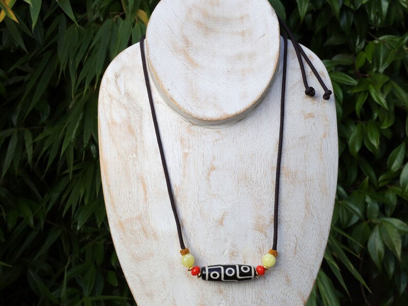 Black white Carnelian Onyx DZI nine bead Agate Stone Choker, with an adjustable necklace with a slide knot.  Features red and  yellow beads.