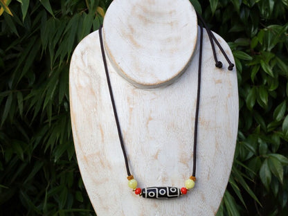 Black white Carnelian Onyx DZI nine bead Agate Stone Choker, with an adjustable necklace with a slide knot.  Features red and  yellow beads.
