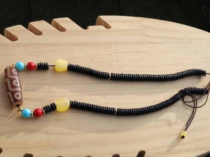 Carnelian Onyx DZI nine bead Agate Stone Choker, with an adjustable necklace with a slide knot. Features red, turquoise,yellow spacer beads.