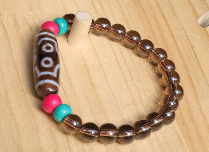 Old  Seven-eye dZi bead Smoky Quartz bracelet with Howlite Beads with engraved Buddhist Tibetan decoration and Dark pink roundel. Dzi bead