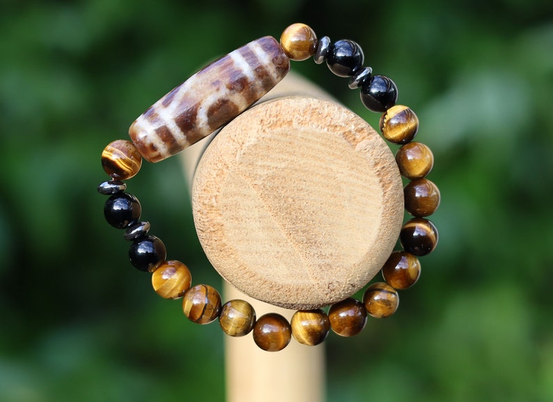 Old one eyed Dzi  bead Tiger eye bracelet with Black agate.These beads are believed to bring spiritual benefits and protection to the wearer