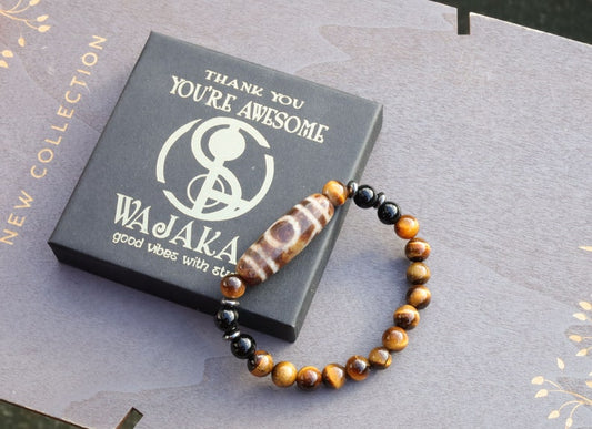 Old one eyed Dzi  bead Tiger eye bracelet with Black agate.These beads are believed to bring spiritual benefits and protection to the wearer