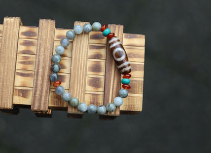 Old one eyed Dzi  bead Spectrolite bracelet with  Turquoise Howlite Beads with engraved Buddhist Tibetan decoration.