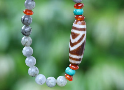 Old one eyed Dzi  bead Spectrolite bracelet with  Turquoise Howlite Beads with engraved Buddhist Tibetan decoration.