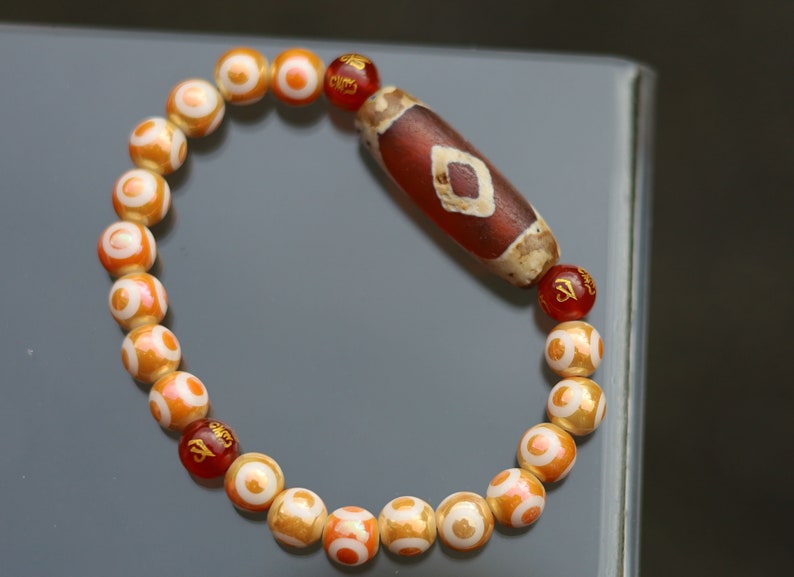 Old Two-eye Dzi  bead bracelet with Electroplate Glass Beads , Round with Evil Eye Pattern,Orange. unblock the path to enlightenment.