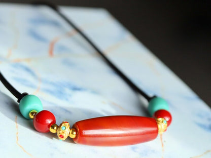 Carnelian Onyx DZI bead Agate Stone Choker, with an adjustable necklace with a slide knot.  Features red and  turquoise spacer beads.