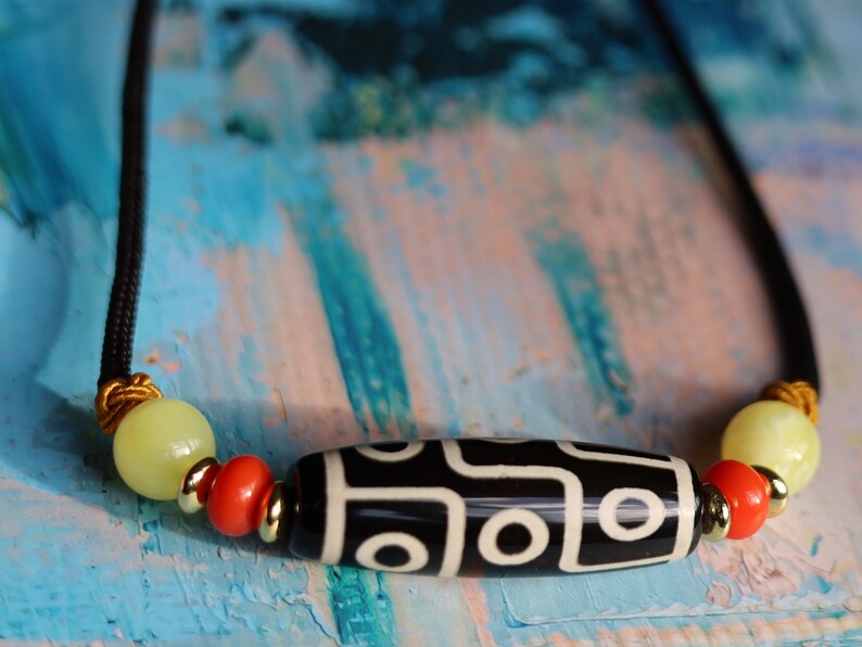 Black white Carnelian Onyx DZI nine bead Agate Stone Choker, with an adjustable necklace with a slide knot.  Features red and  yellow beads.