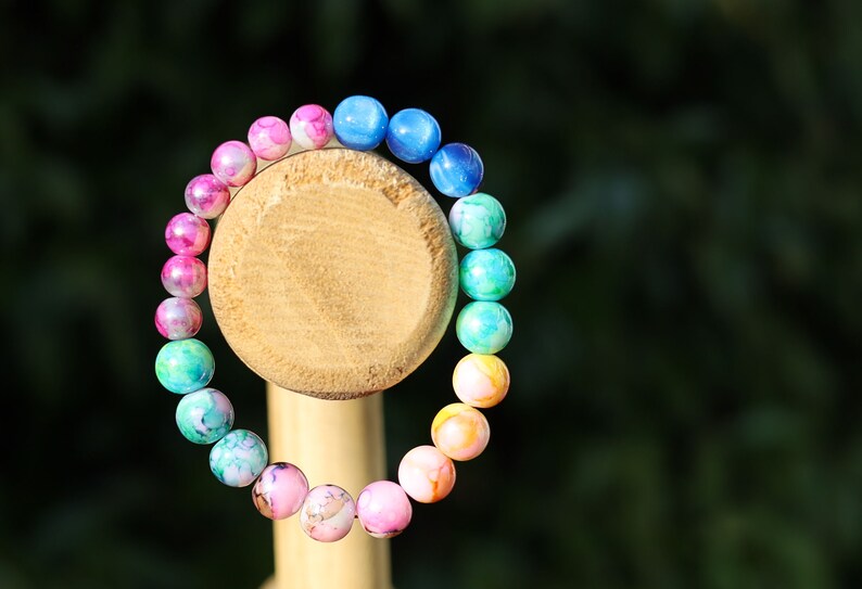 Flashy bracelets Pieces of beautiful mixed color amazing glass beads and holographic beads.is often associated with transparency, clarity