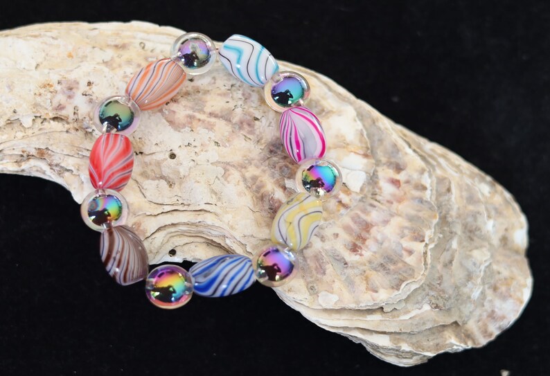 Flashy bracelets Pieces of beautiful mixed color amazing glass beads and holographic beads.is often associated with transparency, clarity
