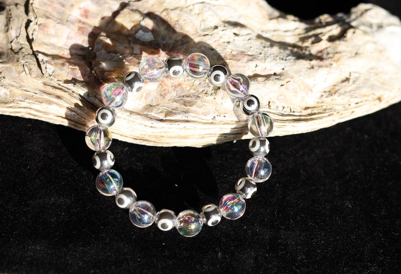Flashy set bracelets with Electroplate Glass Beads  Round with Evil Eye  and Aurora Borealis. Also Gold plated spacer beads.