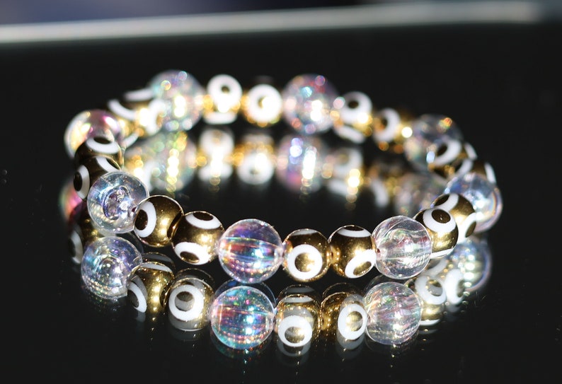Flashy set bracelets with Electroplate Glass Beads  Round with Evil Eye  and Aurora Borealis. Also Gold plated spacer beads