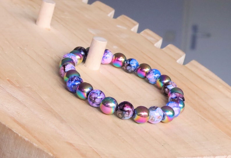 Flashy set bracelets with Electroplate Glass Beads  Round with Evil Eye  and Aurora Borealis. Also Gold plated spacer beads