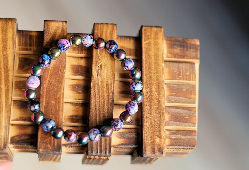 Flashy set bracelets with Electroplate Glass Beads  Round with Evil Eye  and Aurora Borealis. Also Gold plated spacer beads