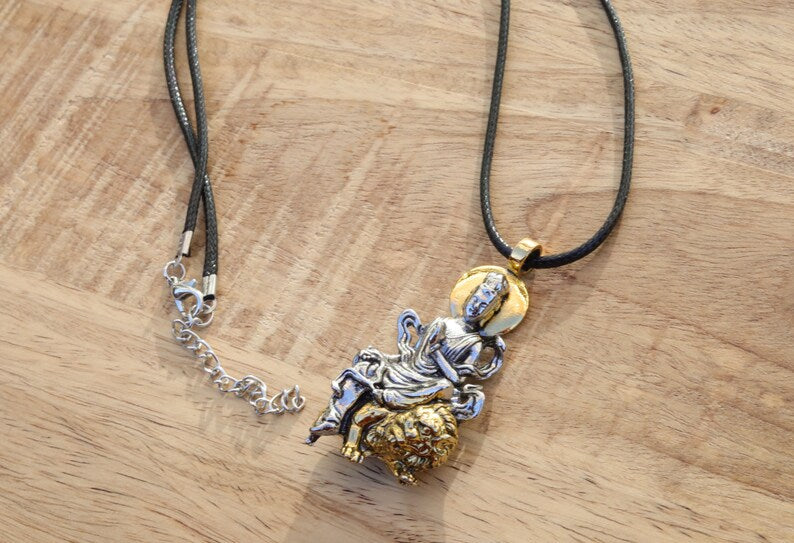 Particular Buddhist Sculpture Buddha Pendant necklace.  reverence for the Buddha's teachings, a reminder of mindfulness
