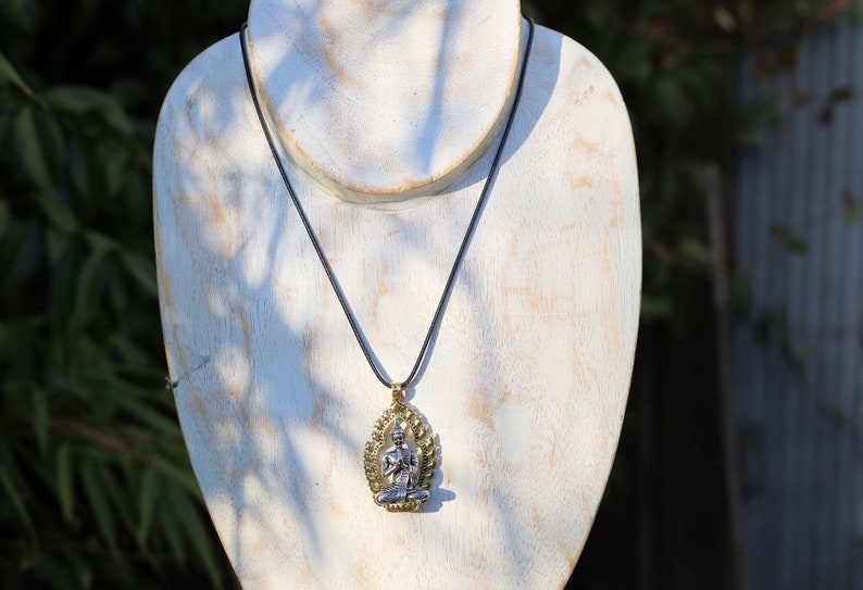 Noteworthy Buddhist Sculpture Buddha Pendant necklace. source of inspiration for leading a compassionate and mindful life