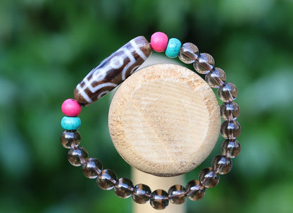 Old  Seven-eye dZi bead Smoky Quartz bracelet with Howlite Beads with engraved Buddhist Tibetan decoration and Dark pink roundel. Dzi bead