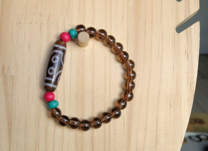 Old  Seven-eye dZi bead Smoky Quartz bracelet with Howlite Beads with engraved Buddhist Tibetan decoration and Dark pink roundel. Dzi bead