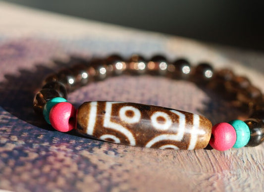 Old  Seven-eye dZi bead Smoky Quartz bracelet with Howlite Beads with engraved Buddhist Tibetan decoration and Dark pink roundel. Dzi bead
