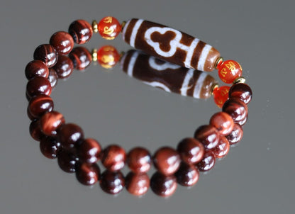 Old Bodhi Dzi  bead Tiger eye bracelet with Black agate.These beads are believed to bring spiritual benefits and protection to the wearer