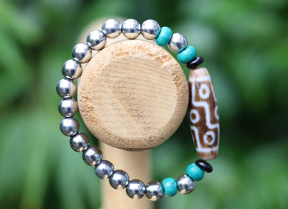 Old nine eyed Dzi  bead The Hematite crystal bracelet with Tibetan turquoise buddhist prayer beads.  capability to control life