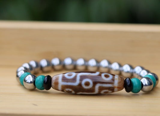 Old nine eyed Dzi  bead The Hematite crystal bracelet with Tibetan turquoise buddhist prayer beads.  capability to control life
