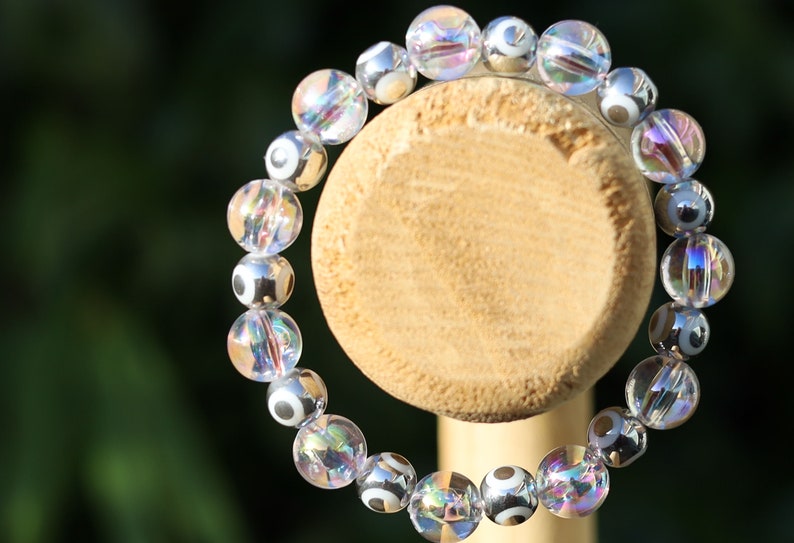Flashy set bracelets with Electroplate Glass Beads  Round with Evil Eye  and Aurora Borealis. Also Gold plated spacer beads.