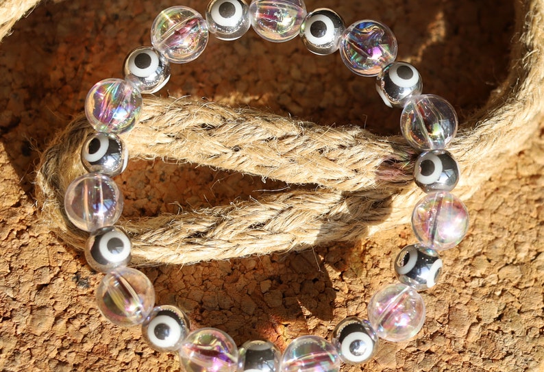 Flashy set bracelets with Electroplate Glass Beads  Round with Evil Eye  and Aurora Borealis. Also Gold plated spacer beads.