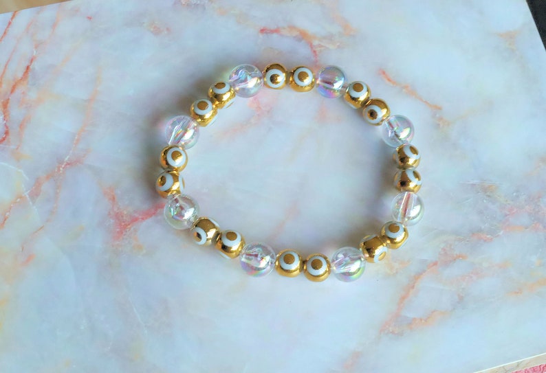 Flashy set bracelets with Electroplate Glass Beads  Round with Evil Eye  and Aurora Borealis. Also Gold plated spacer beads