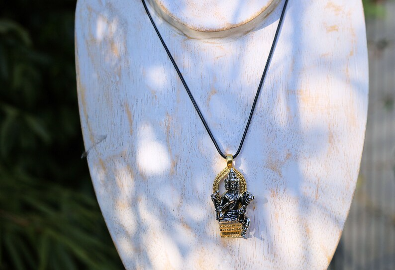 Exquisite Buddhist Sculpture Buddha Pendant necklace. Reminder of the path toward enlightenment and the pursuit of inner peace