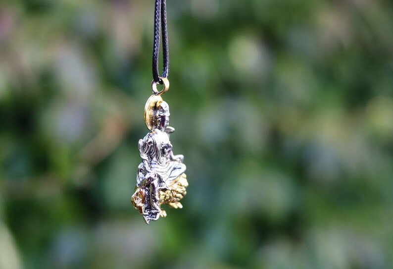 Particular Buddhist Sculpture Buddha Pendant necklace.  reverence for the Buddha's teachings, a reminder of mindfulness