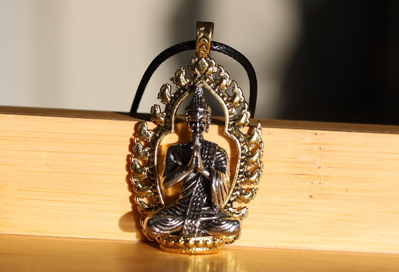 Noteworthy Buddhist Sculpture Buddha Pendant necklace. source of inspiration for leading a compassionate and mindful life