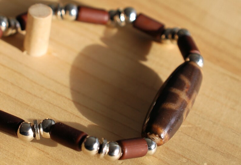 Old Big man (Aristocrat) Dzi  bead  with Natural Wood Beads, tube, Coconut Brown and Silver Plated Smooth Round/ discs Metal Beads