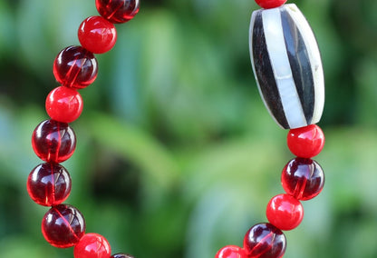 One of a kind Mexico red blood beeswax beads Certified 8mm. Combined with Crimson Burst Flower Stone and  Mother of Pearl Black.