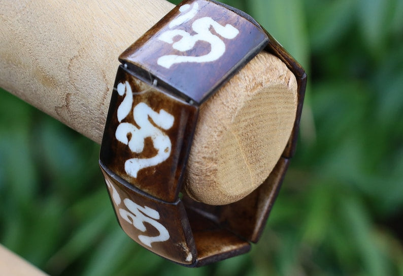 The bracelet is MAGICAL . This unique premium quality unisex elastic band bracelet with AUM.