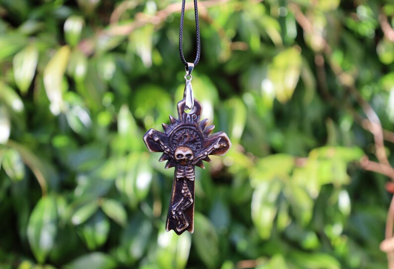 A skeleton on a cross pendant, Handmade old Carved Amulet. Ethnic & Regional Style South American. handmade figures