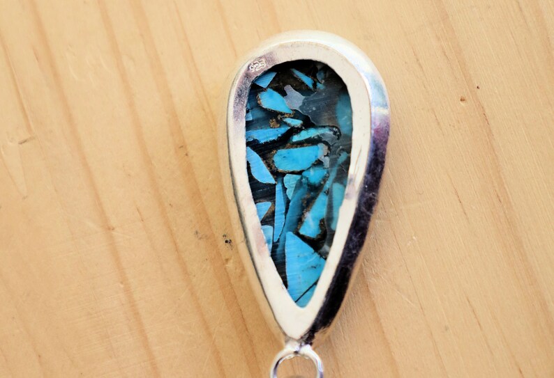 A natural Chrysocolla silver 925 pendant combines the symbolism of Chrysocolla as a gemstone and the design of a style necklace