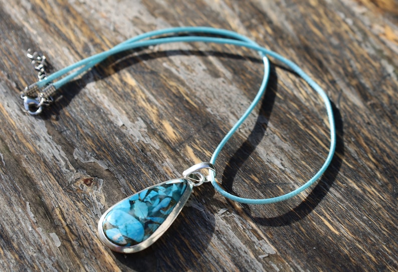 A natural Chrysocolla silver 925 pendant combines the symbolism of Chrysocolla as a gemstone and the design of a style necklace