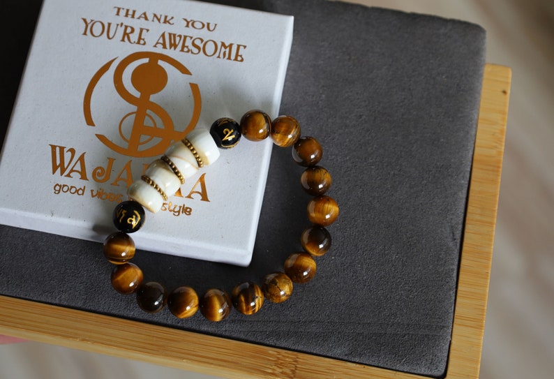 Large Apple Shell Heishi beads with large Apple Shell Heishi beads beads and 10mm Tiger eye.  into a state of calm aiding