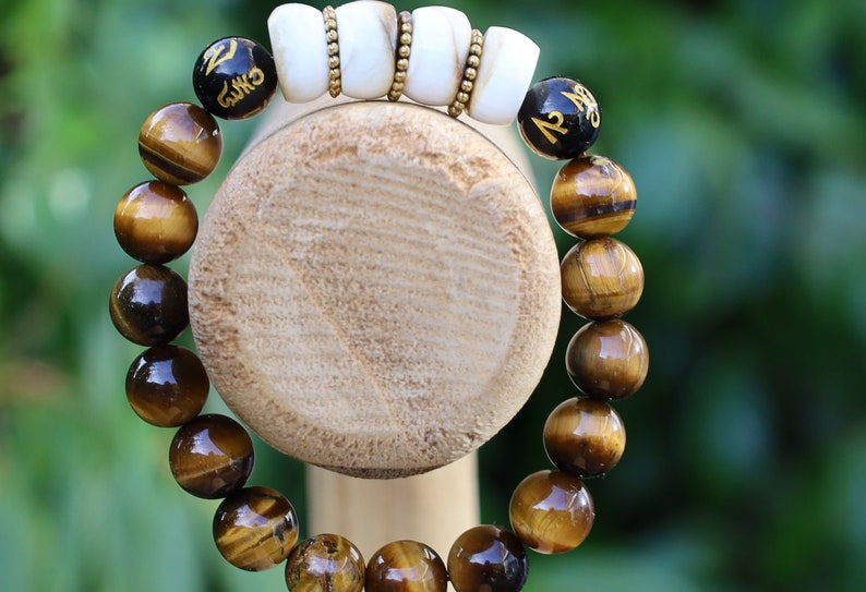 Large Apple Shell Heishi beads with large Apple Shell Heishi beads beads and 10mm Tiger eye.  into a state of calm aiding