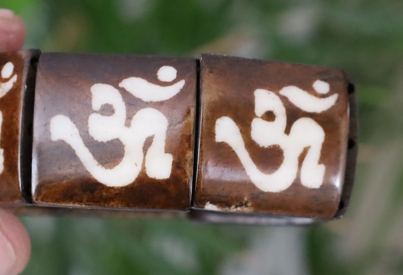 The bracelet is MAGICAL . This unique premium quality unisex elastic band bracelet with AUM.