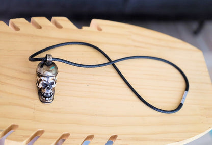 A bone skull amulet or pendant with metal mounting that originates from Nepal can hold various meanings and cultural significance.