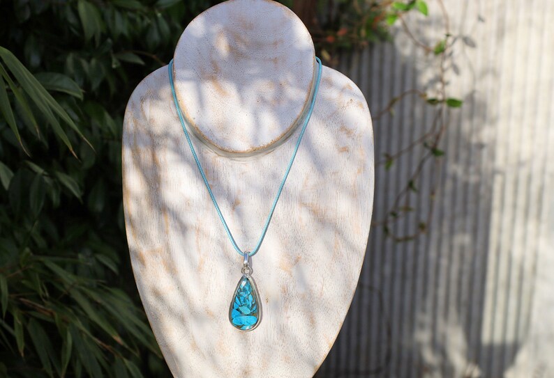 A natural Chrysocolla silver 925 pendant combines the symbolism of Chrysocolla as a gemstone and the design of a style necklace