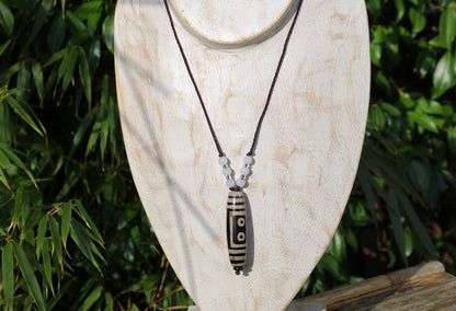 Double Tiger Tooth, or Tasso pendant necklace.  It is also revered as a spiritual object, capable of keeping away evil things