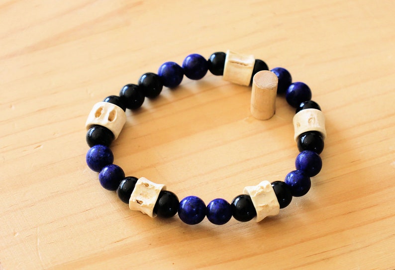 Real tribal Snake Vertebrae, Natural Bone Beads combined with Lapis Lazuli  and black Agate. The serpent jewelry teaches us purification.