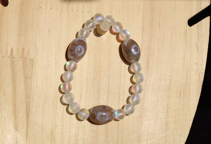 Three Dzi  barrel bead Agate bracelet with Matte Aurora Crystal Glass Beads," also known as "Frosted Mystic Aura Mermaid Beads