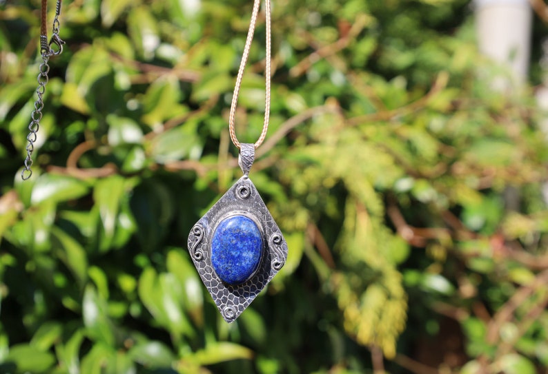 Gorgeous Lapis Lazuli 925 Silver Plated Handmade Pendant   Lapis lazuli is a deep-blue metamorphic rock that has been prized since antiquity for its intense color