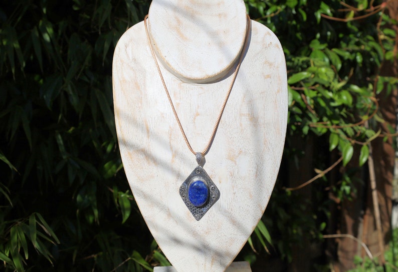 Gorgeous Lapis Lazuli 925 Silver Plated Handmade Pendant   Lapis lazuli is a deep-blue metamorphic rock that has been prized since antiquity for its intense color